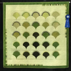 2022 BEST MACHINE QUILTING:TRACK-Medium Pieced by One-Cake Plate-Salena Korpi Beckwith