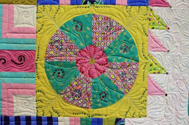 "Butterflies are Self-Propelled Flowers" close-up; pieced bu Susan Lavender; track machine quilted by Cynthia Fuelling; 1st Place Medium Pieced by Two or More. 2nd Viewers' Choice.