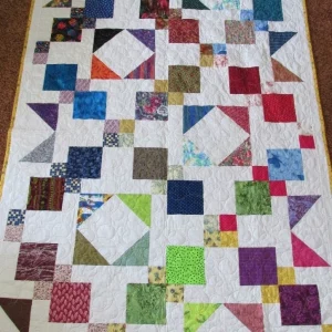 multiple geometric patterns on white quilt