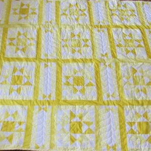 yellow and white quilt