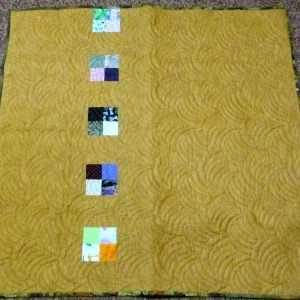 yellow quilted blanket