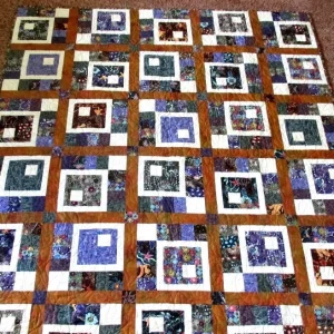white small squares on patchwork quilt