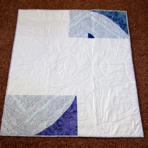 blue and gray and white quilt