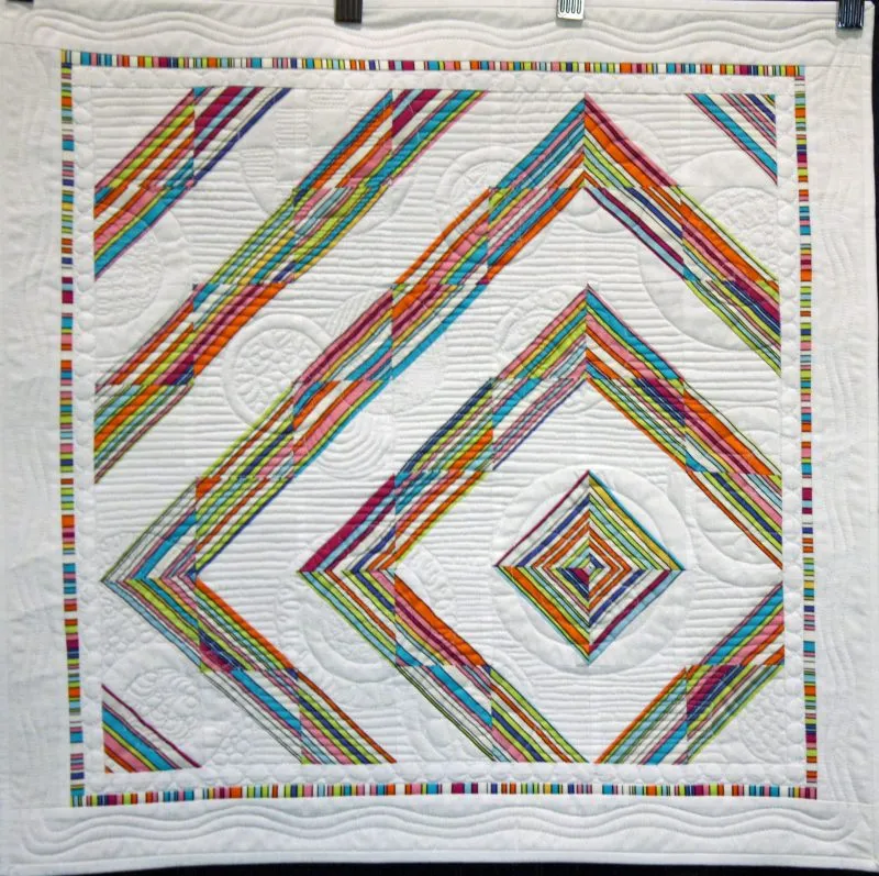 3rd Place - Modern; "No Strings Attached" by Carol Herbst, quilted on her domestic, stationary machine