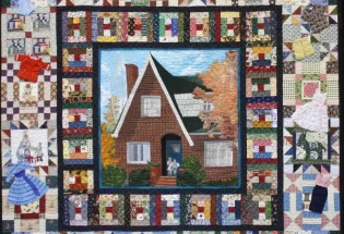 udge's Choice - Kathie Kerler; "The Fabric of My Life" by Jean Van Bockel, track machine quilted by Susan Nelsen