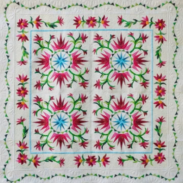 White Quilt with red flowers