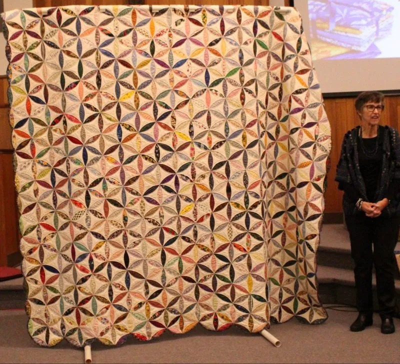 Joseph's Coat of Many Colors made by Kathy Webb. Handpieced and quilted as my grandmother's last quilt and took 25 years to complete!