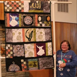 Turkish Dervish by Sonya Parisi. This is a custom request with specific designs. Hand applique'd and hand quilted.