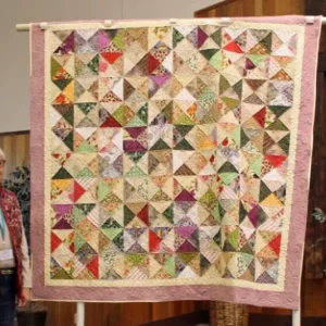 Aleida Houdyshell made this quilt after buying Missouri Star Block books at the BBQ book sale. This was the right pattern to use her left over fabric pieces.