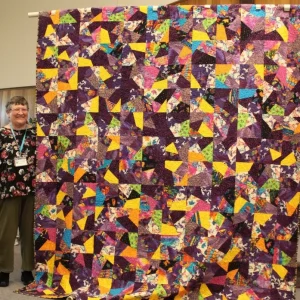 Connie Buchanon made this lovely quilt from Laurel Burch fabrics to keep her warm in the Winter.