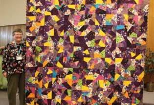 Connie Buchanon made this lovely quilt from Laurel Burch fabrics to keep her warm in the Winter.