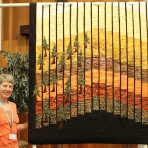 Donna Swanson made this Fall Quilt and quilted it on her long arm. She purchased it as a kit at a quilt shop in Mt. Vernon, Ohio. Every fall, her husband helps hang it in their living area.
