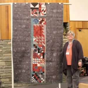 Karen Falvey wanted to use up leftover blocks and fabric from a Downton Abbey Quilt. She started out with a table runner and ended up with a twin size bed quilt that will coordinate with a queen size quilt in their AirBnB.