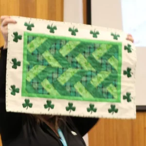Tara Henderson made her Irish Table Topper using her Cricut Maker to cut the shamrocks. This is her first attempt at applique. Nice job Tara!