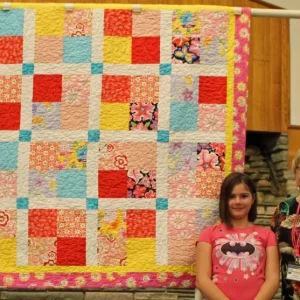 Emily made her first quilt from Grandma Jill Nelson's stash. Emily selected the fabrics, arranged them, did a little sewing and a lot of pressing.