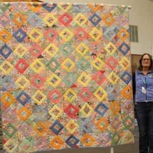 Joleen Graham hand quilted this treasure that was hand pieced by her husband's Grandmother Anna. She has had it since 1974. The Boise Peace Quilt Project helped her start the quilting about 10 years ago and she recently finished the quilting.