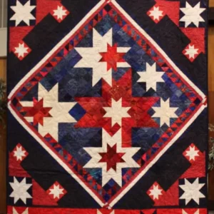 Connie Emmen made this quilt from a wallhanging that had been donated to QoV. She set it on point, added pieced setting triangles and borders. It will be donated to a local American service veteran to thank them for their service.